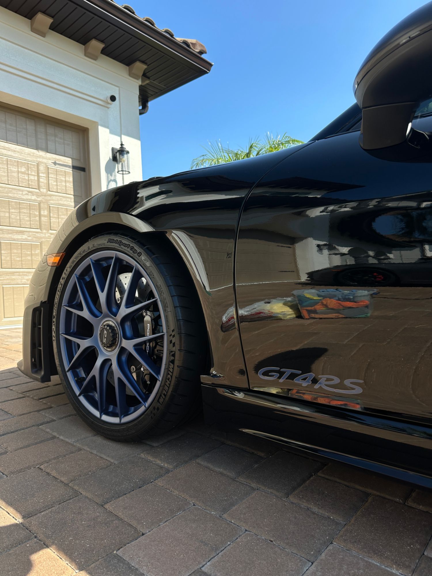 Porsche GT4 RS wheel and paint reflection close-up
