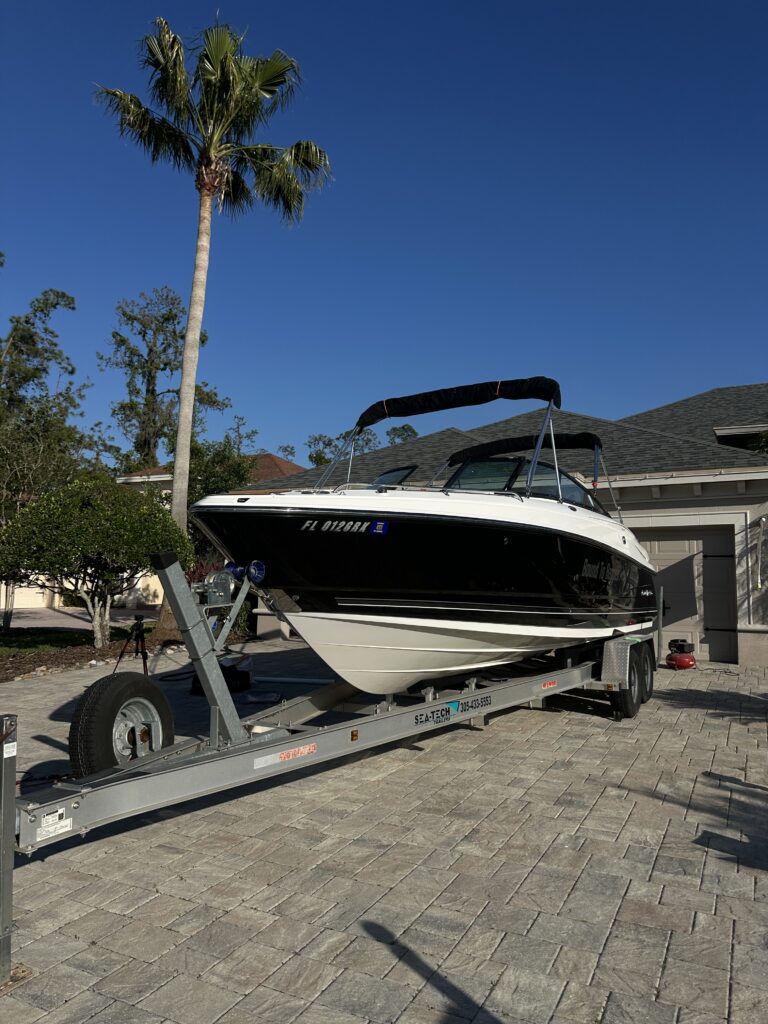 Black Monterey bowrider on its trailer after detailing
