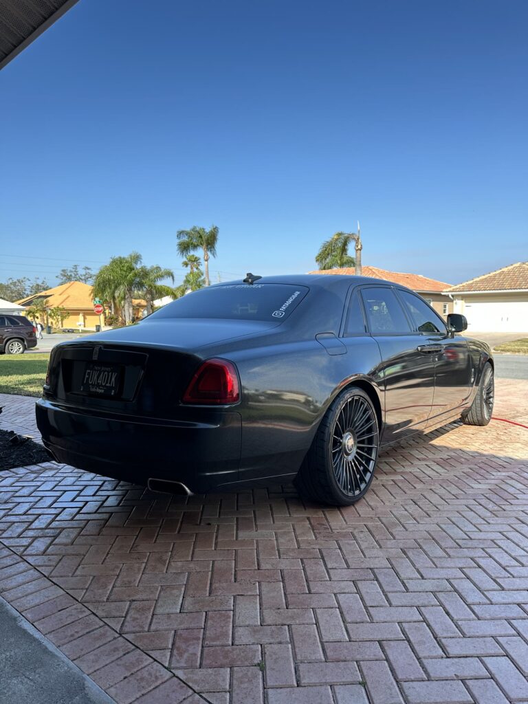 Black Rolls-Royce Ghost — rear view